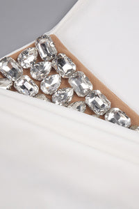 Robe longue dos nu fendue à la queue-de-pie