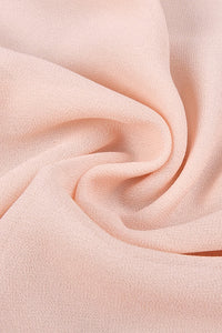 Vestido largo con volantes, espalda descubierta y cuello halter