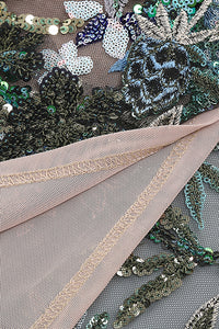 Mini-robe patchwork en dentelle et sequins