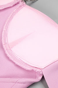Mini robe bandage sans manches à bretelles en rose