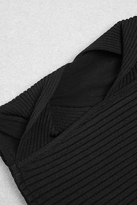 Robe noire à bandes en patchwork de maille à manches longues et col rond