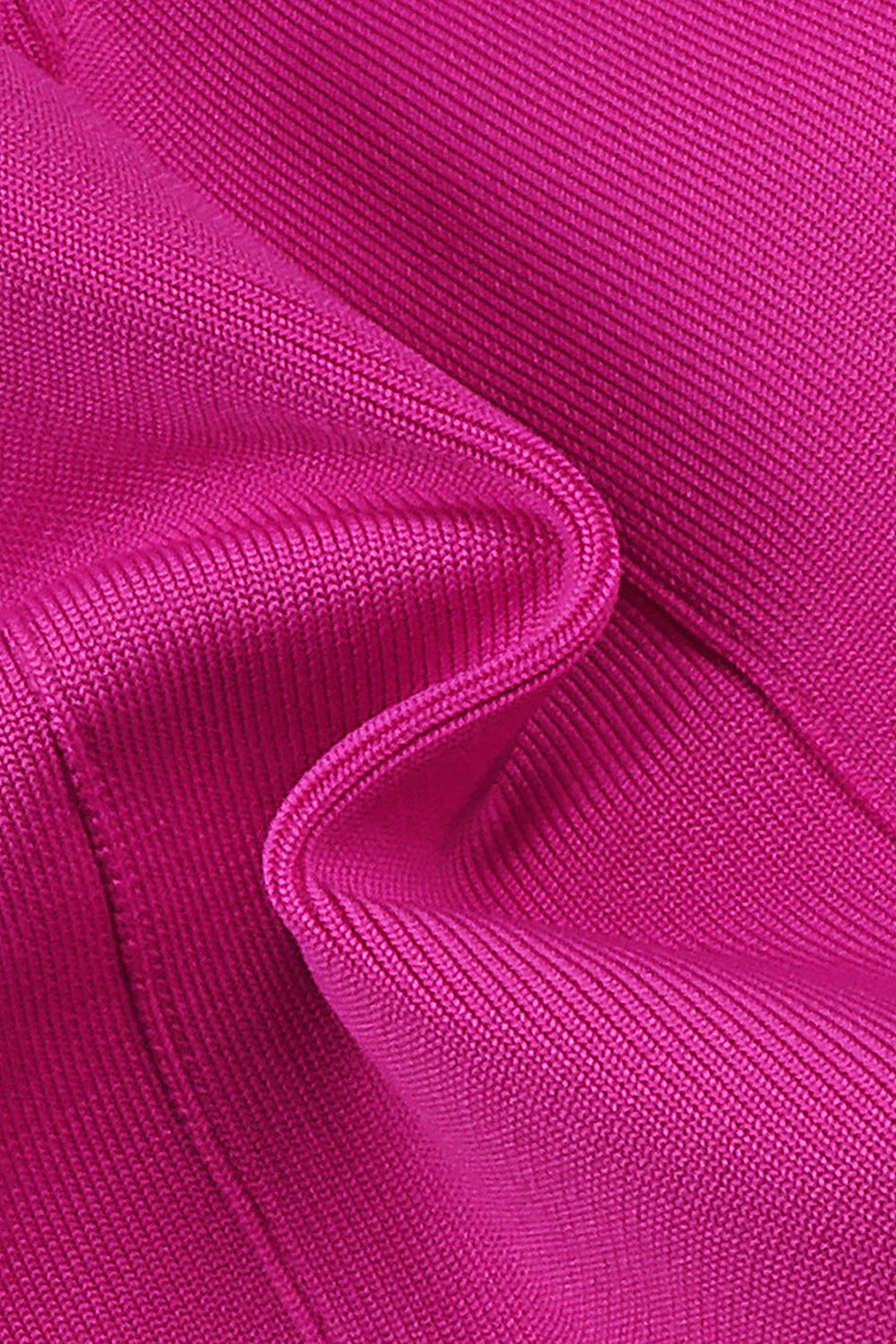Mini robe bandage ornée d'un nœud découpé en rose