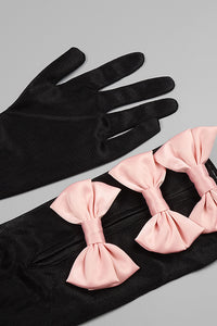 Top estilo corsé con lazo, minifalda y guantes transparentes de Rocks