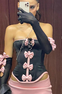 Haut corset, mini-jupe et gants transparents doublés d'un nœud Rocks