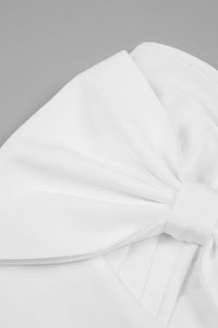 Mini robe bandage sans bretelles avec nœud papillon de créateur en noir et blanc